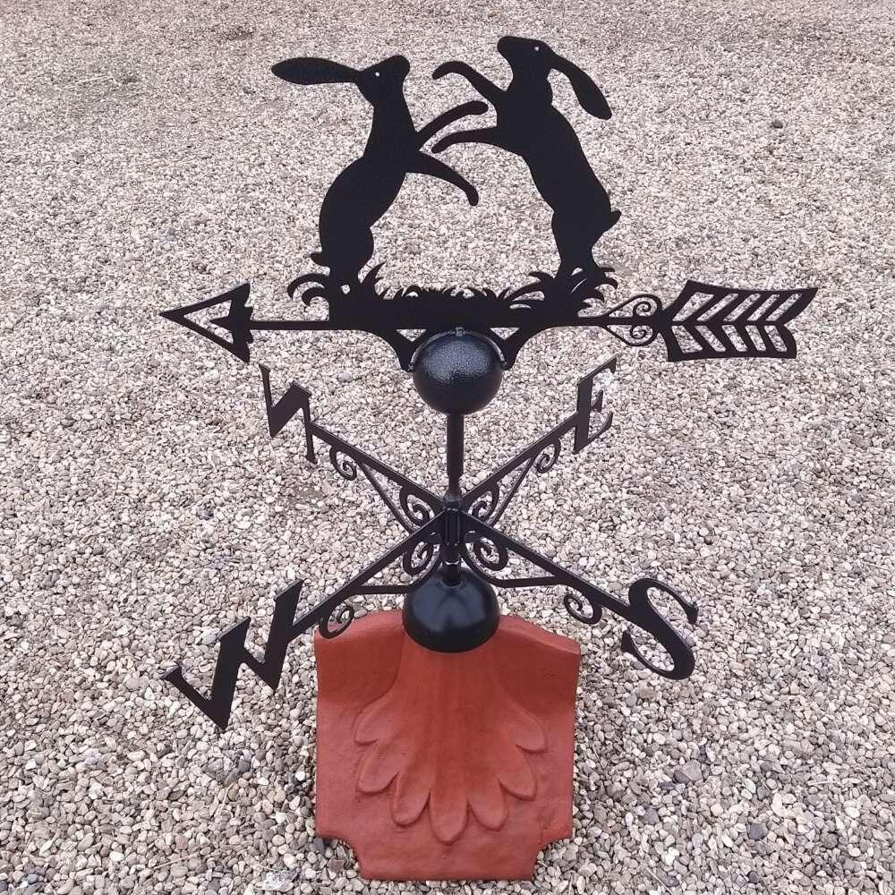 Boxing hares weathervane on a ridge tile finial fitting with multiple angle options