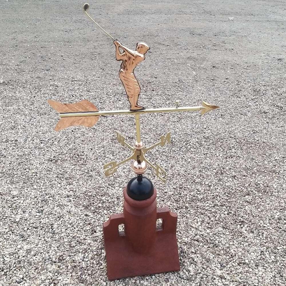 Golfer weathervane mounted on a 90 degree ridge tile finial