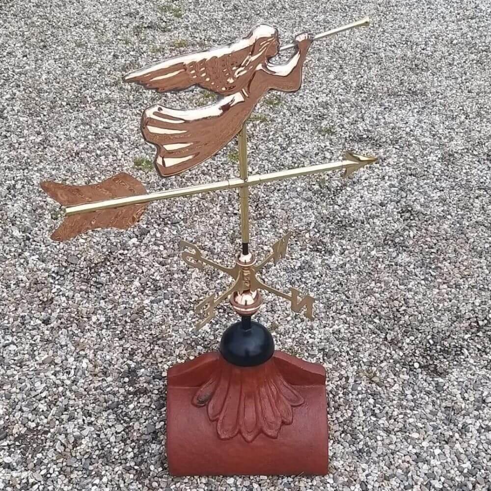 Angel weathervane installed on a half round tile
