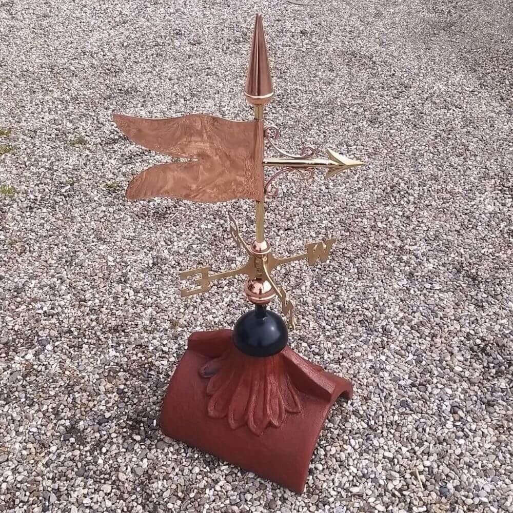 Banner weathervane fitted on a half round roof tile
