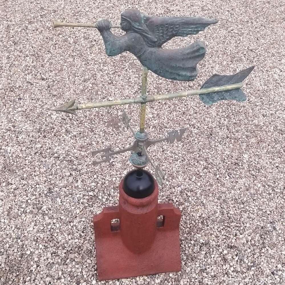 Copper verdigris angel weathervane supplied on a 45 degree ridge tile finial