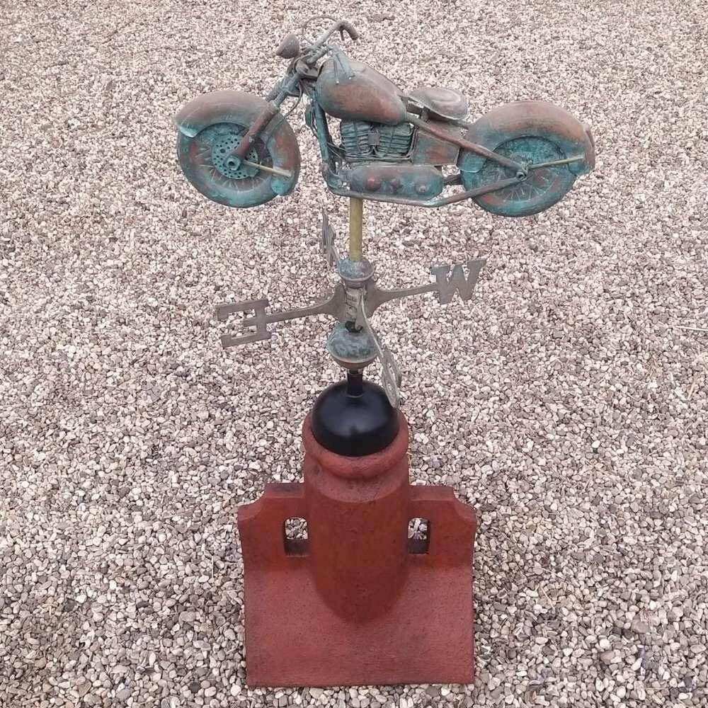 Verdigris motorbike weathervane supplied on a 90 degree ridge base finial