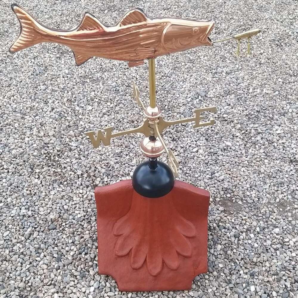 Fish weathervane fitted on a ridge tile finial fitting with multiple angle options