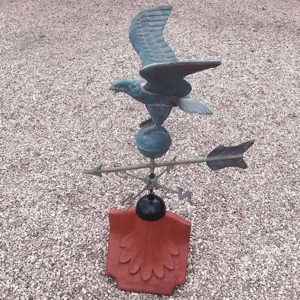 Eagle verdigris weathervane on a ridge tile finial fitting with multiple angle options