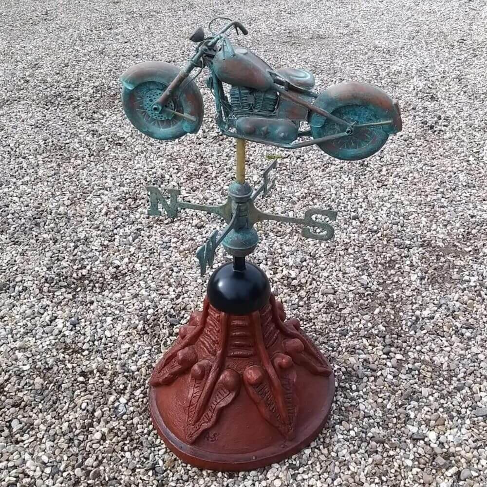 Motorbike weathervane fixed on a round ridge tile capping