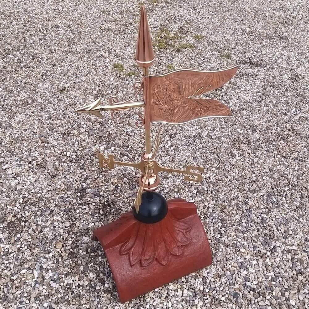 Banner weathervane fitted on a half round ridge