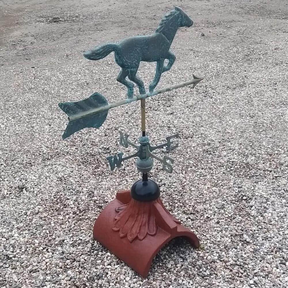 Horse weathervane mounted on a half round tile