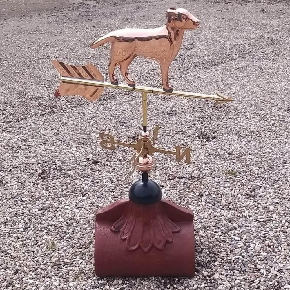 Labrador weathervane fixed to a half round ridge finial