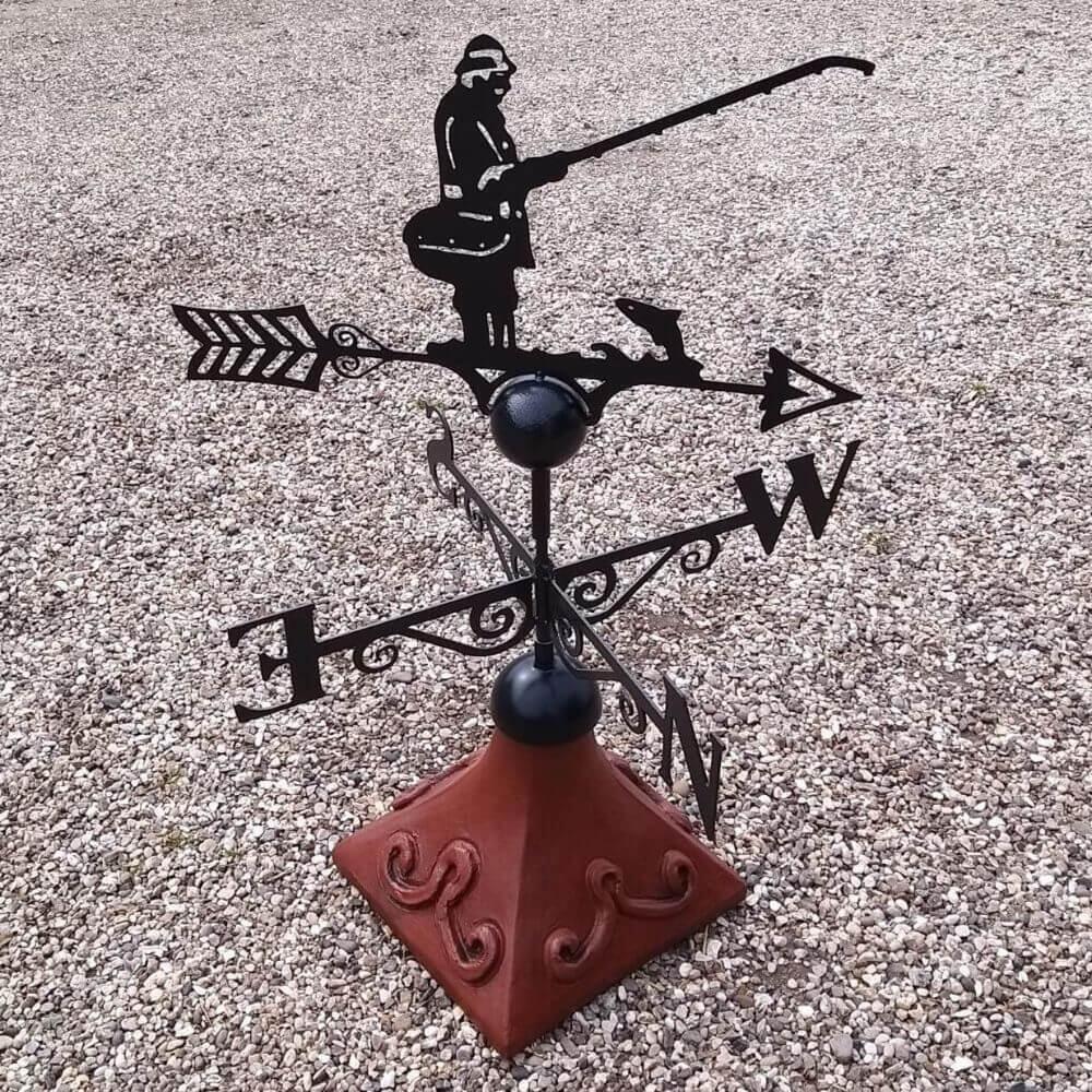 Angler weathervane mounted on a square ridge tile cap