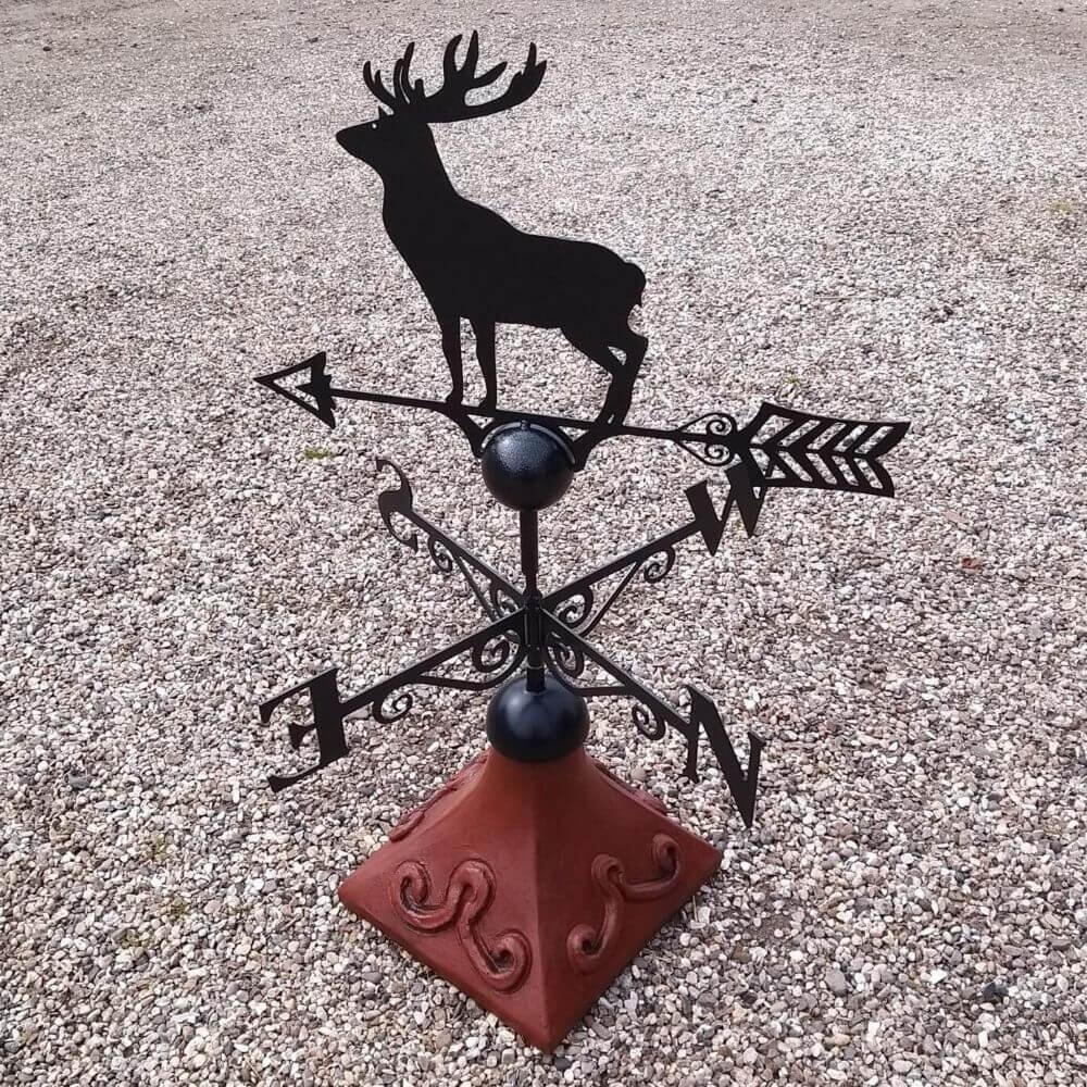 Stag weathervane fixed on a square roof tile capping