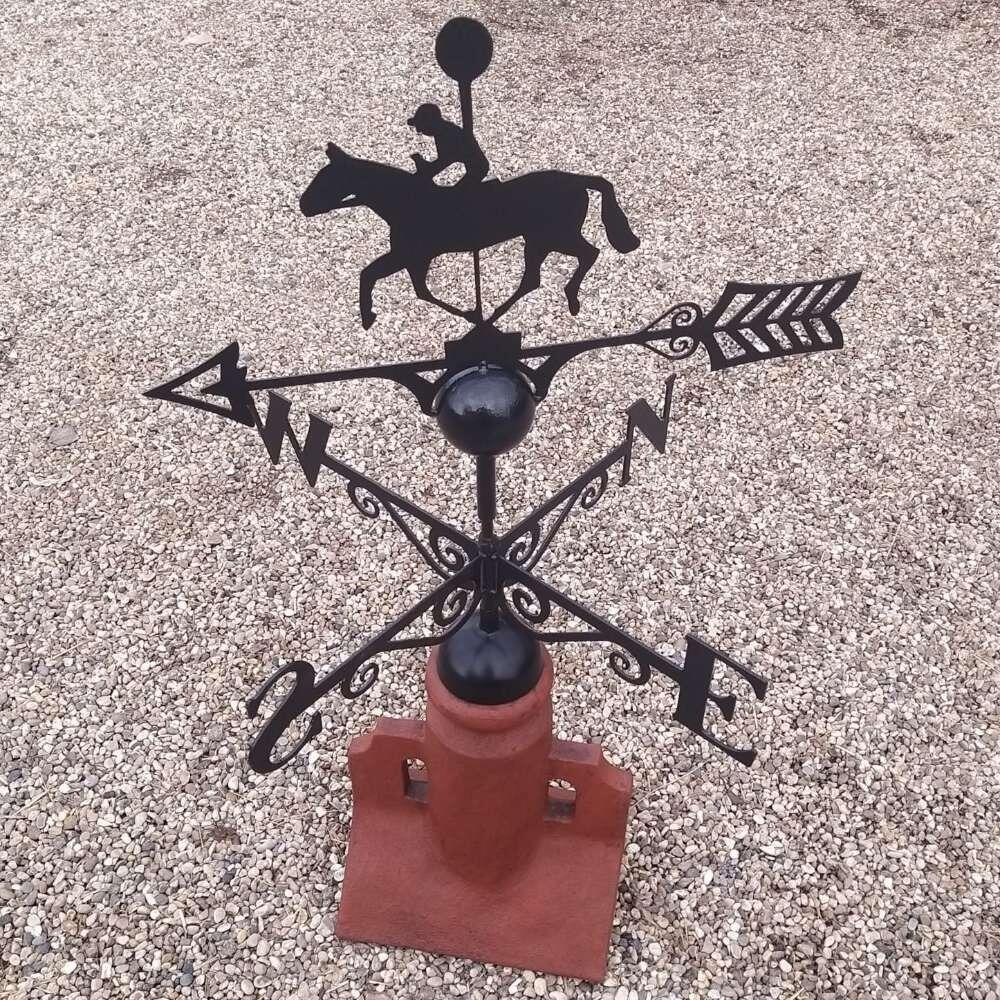 Winning post racing horse weathervane fitted to a 45 degree ridge tile