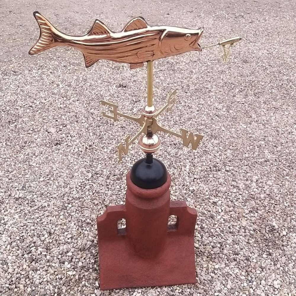 Fish copper weathervane installed on a 45 degree ridge finial