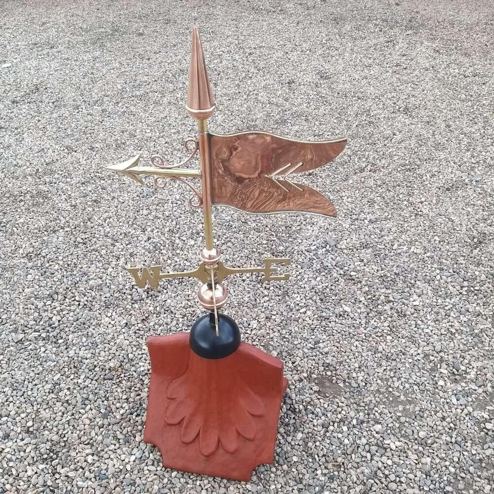 Banner weathervane supplied on a ridge tile finial fitting with multiple angle options