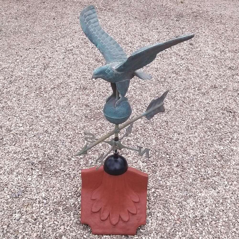 Eagle verdigris weathervane on a ridge tile finial fitting with multiple angle options