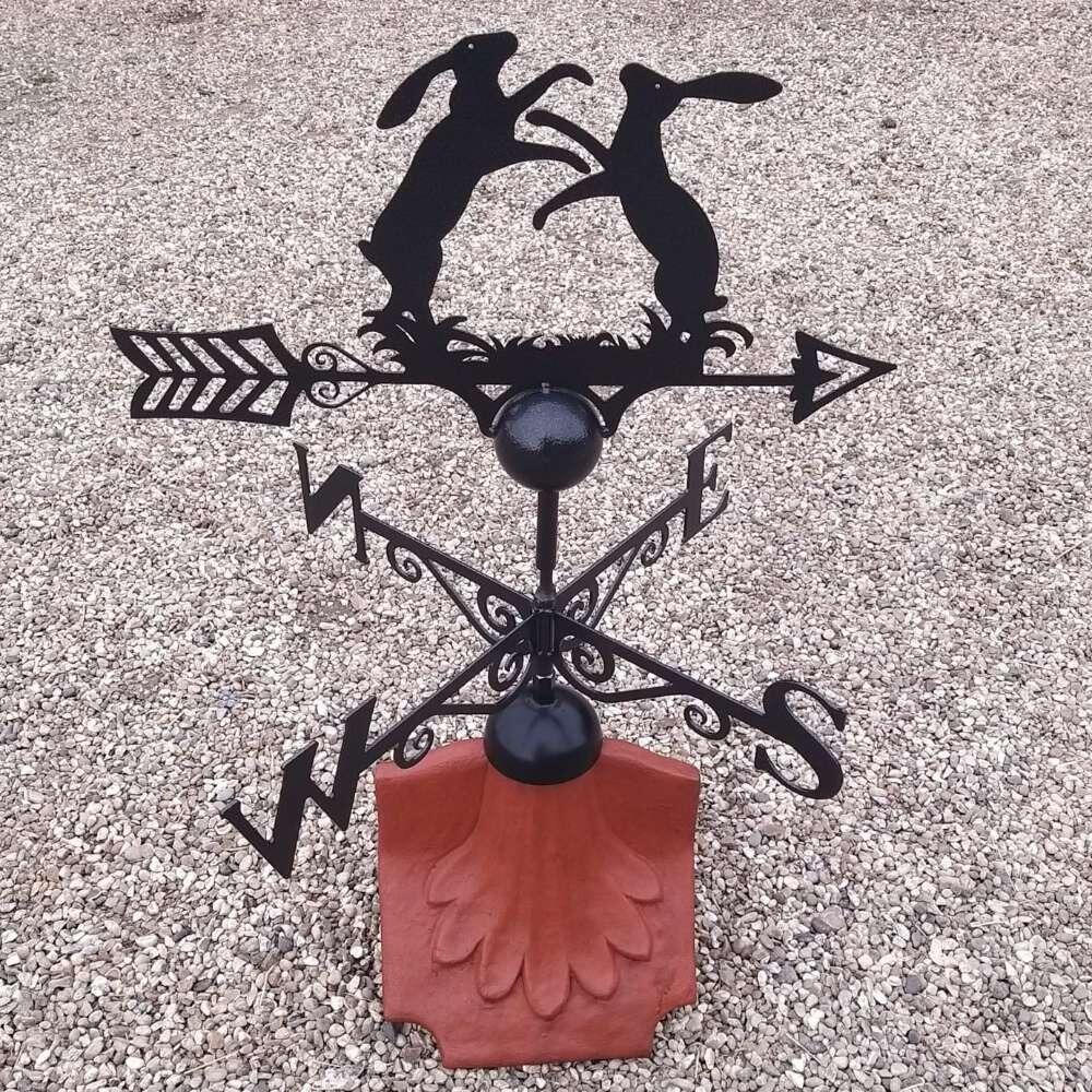 Boxing hares weathervane on a ridge tile finial fitting with multiple angle options