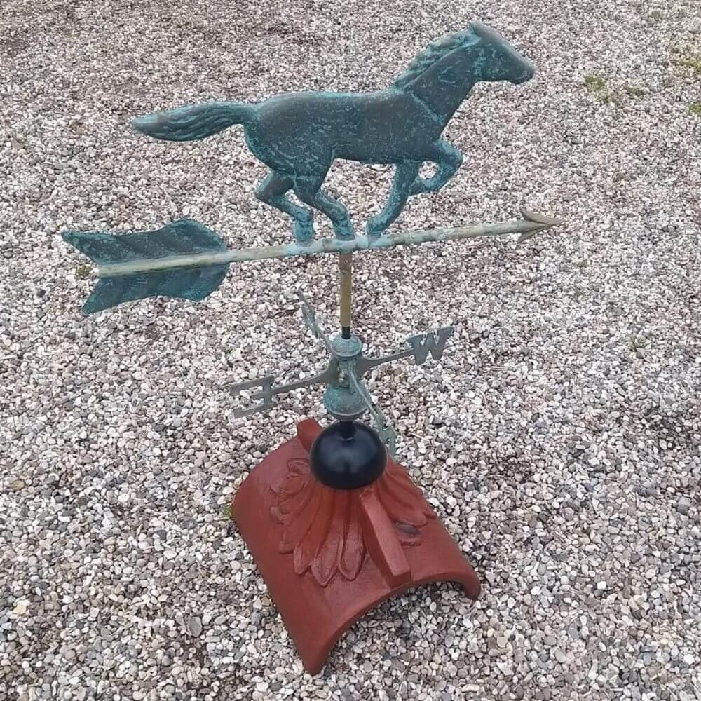 Horse weathervane mounted on a half round roof tile