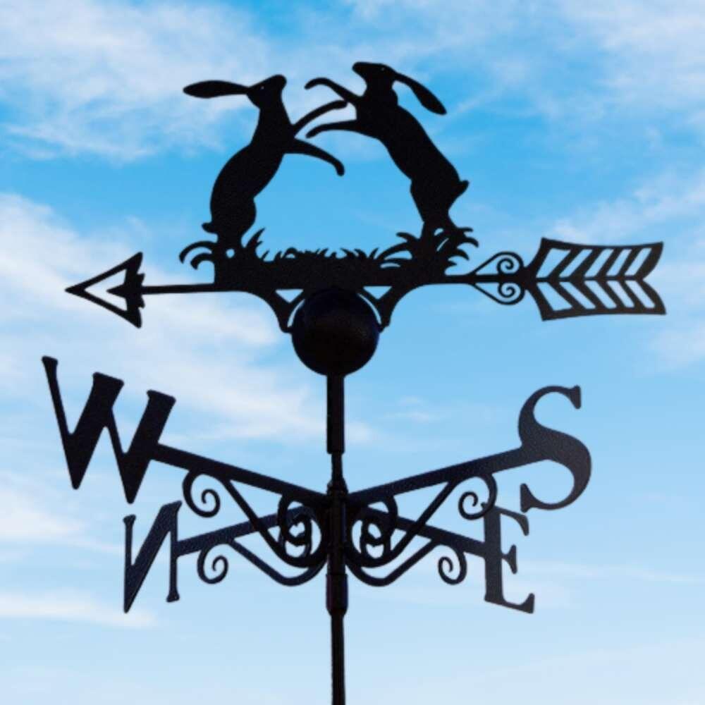 Boxing hares weathervane mounted on a square roof tile capping finial