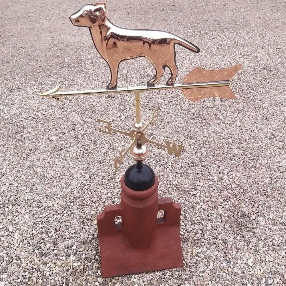 Dog weathervane mounted on a 45 degree ridge base finial
