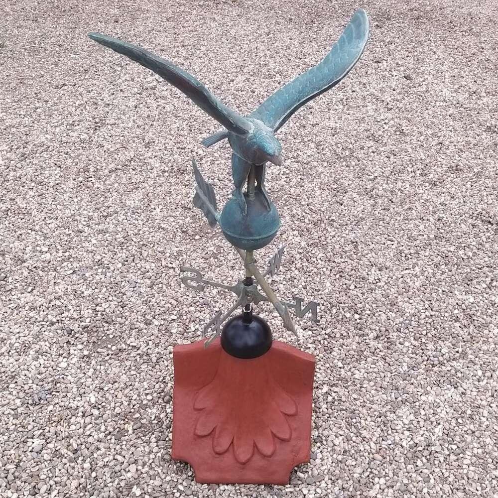 Eagle verdigris weathervane on a ridge tile finial fitting with multiple angle options