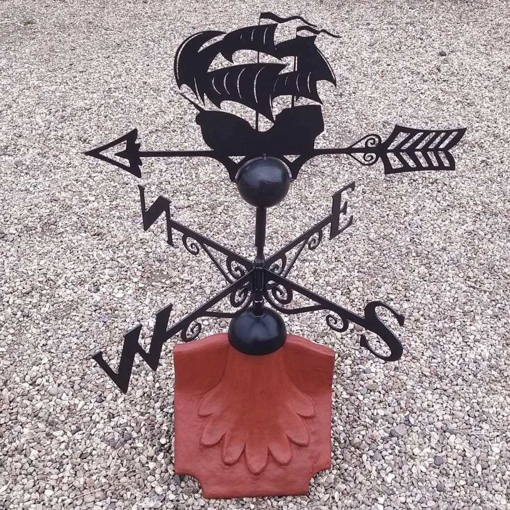 Pirate boat weathervane on a ridge tile finial fitting with multiple angle options