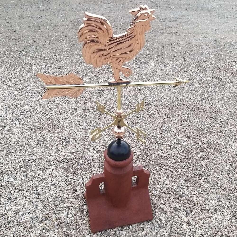 Cockerel weathervane installed on a double arch 90 degree ridge tile finial