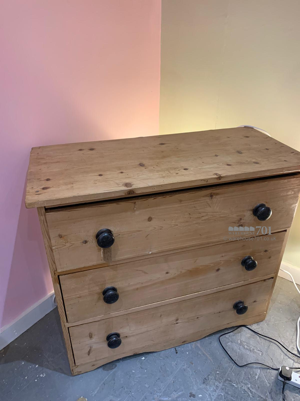 Antique pine chest of drawers with black handles