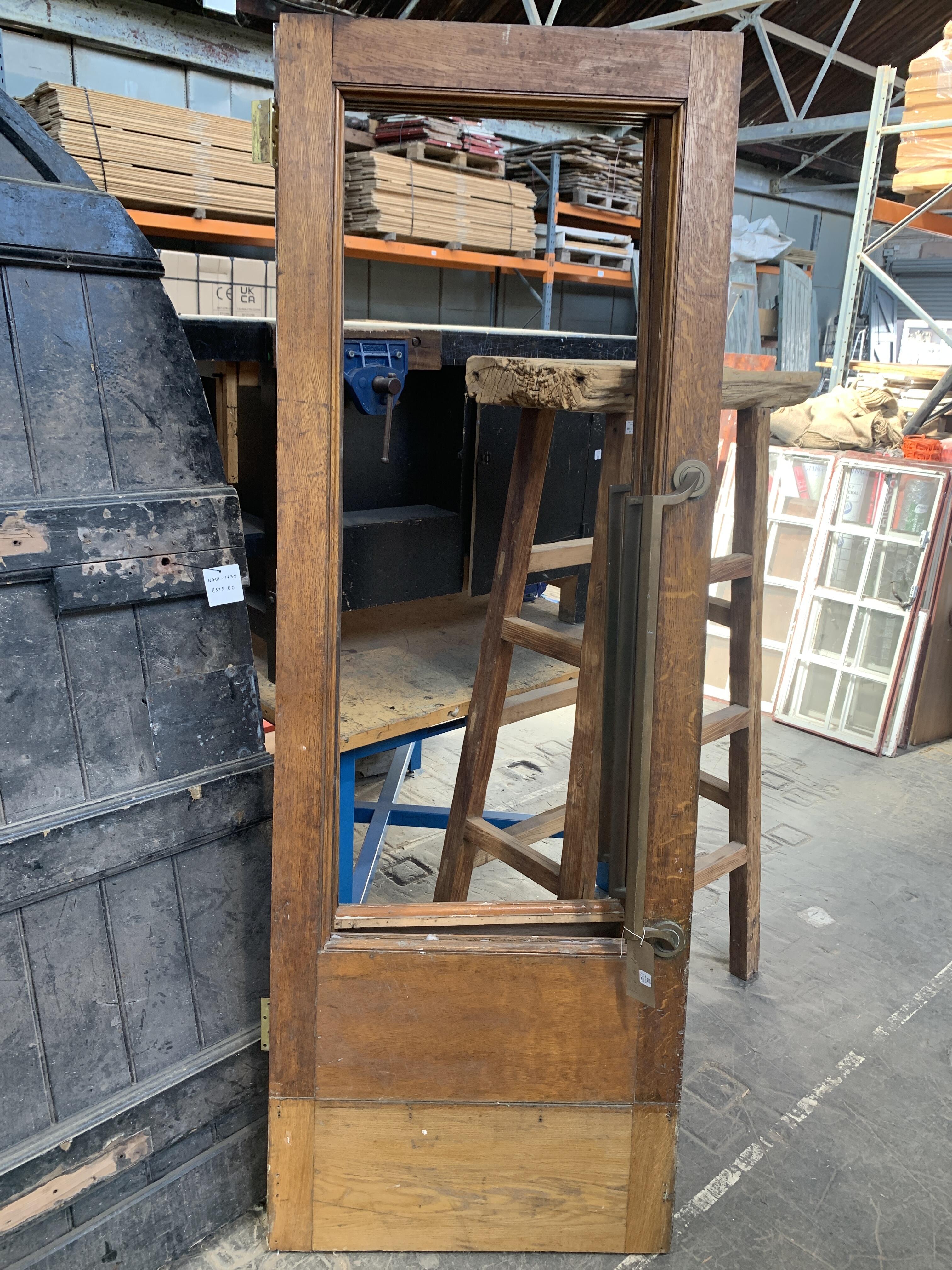 Pair of Reclaimed Wooden Doors with Missing Windows