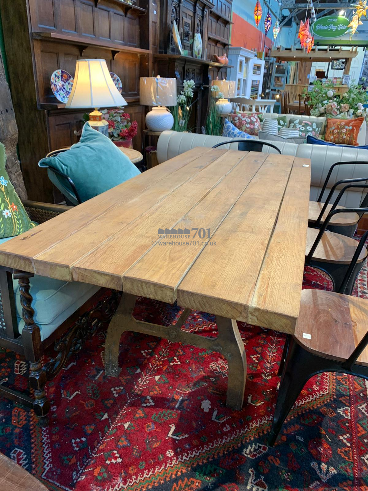 Rustic plank top table with reclaimed metal base
