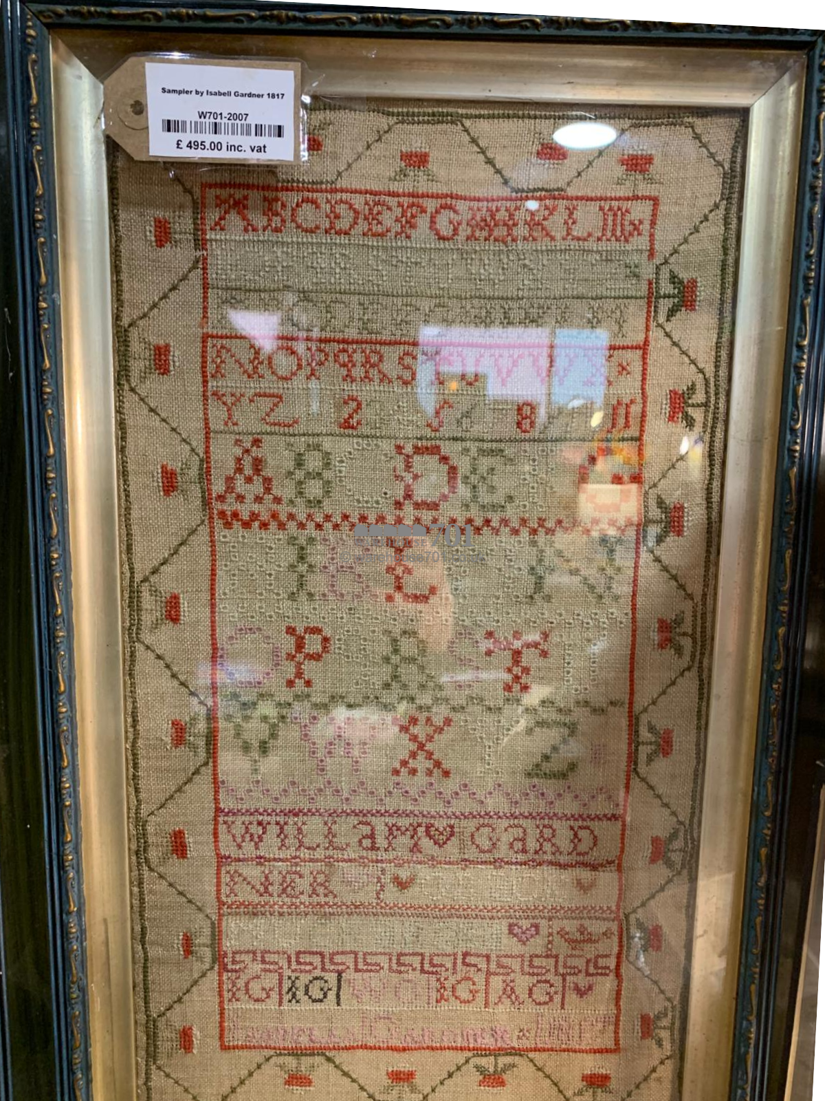 Alphabet sampler framed and glazed with a starwberry border - 1817