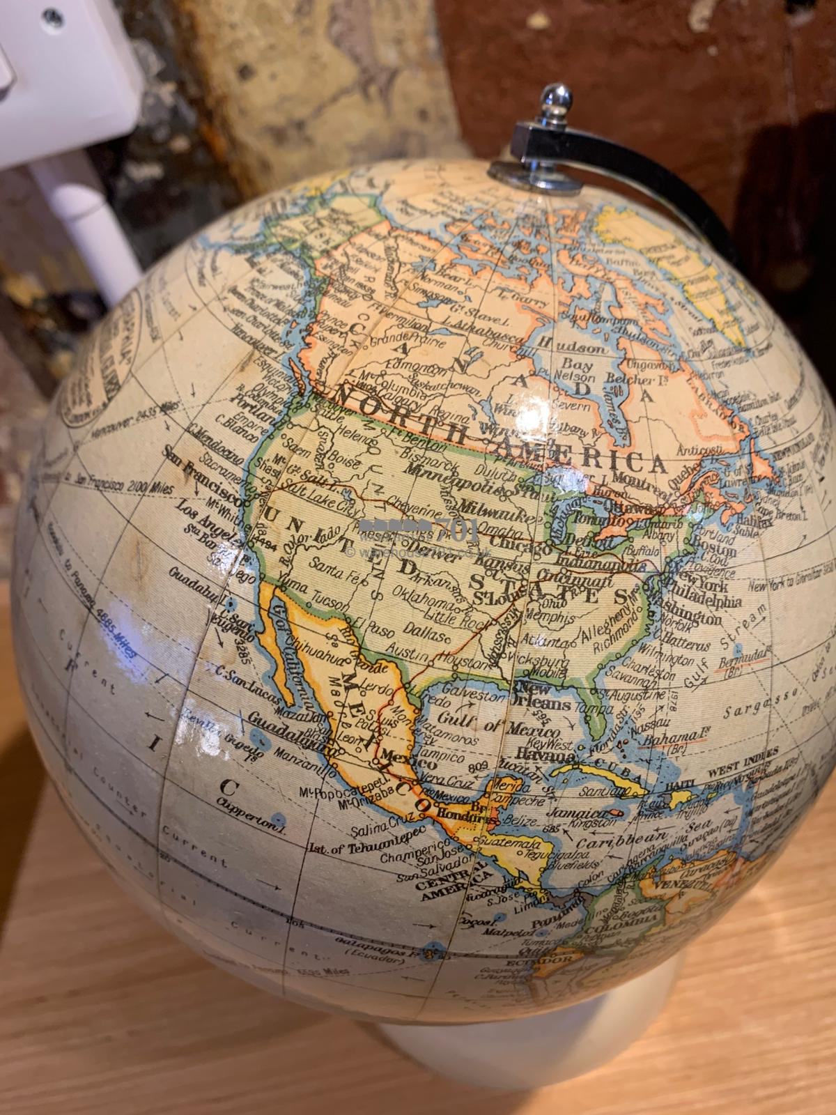 1940 8-inch chrome globe on a Bakelite base