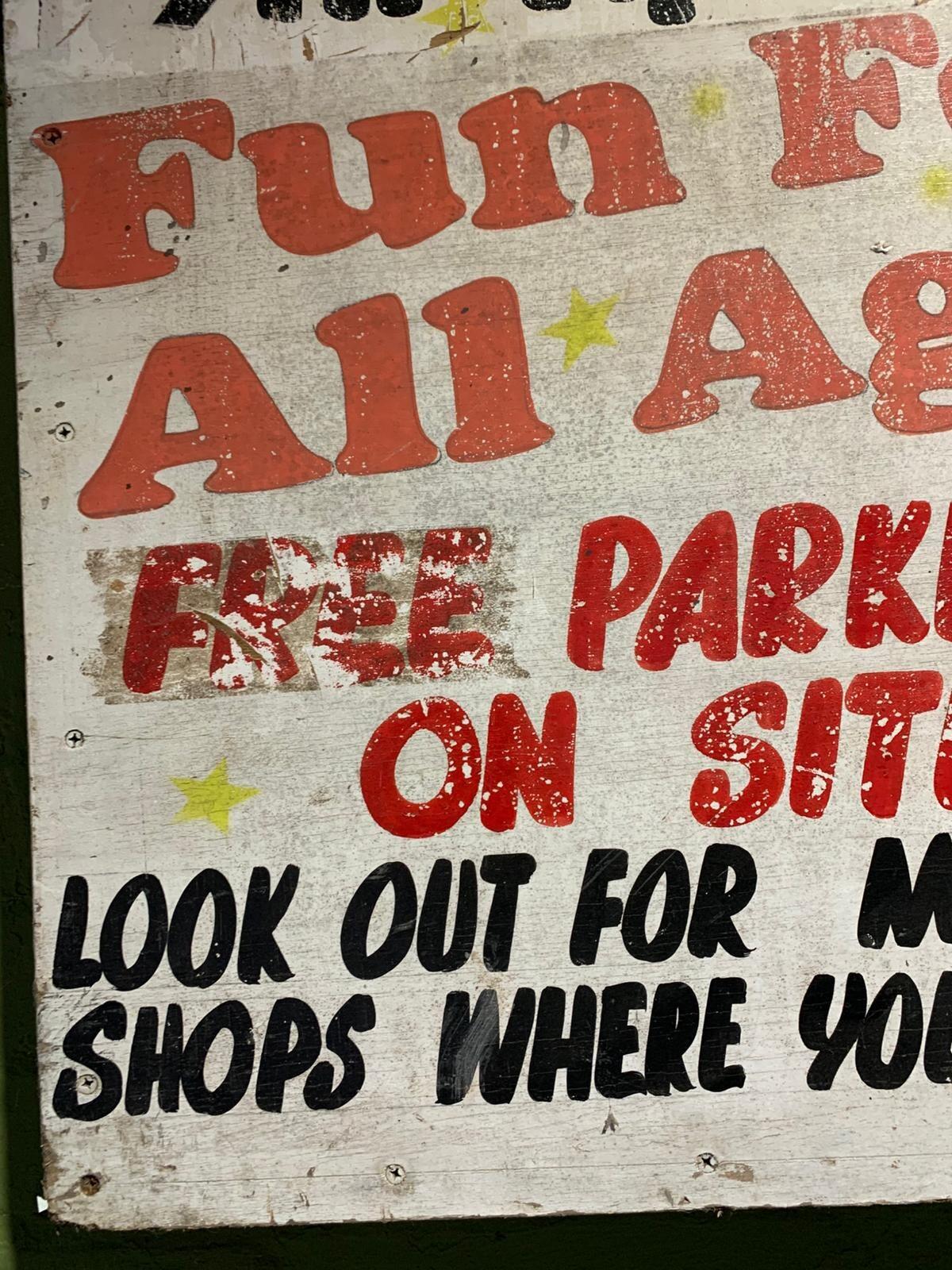 Metal family fun fair sign
