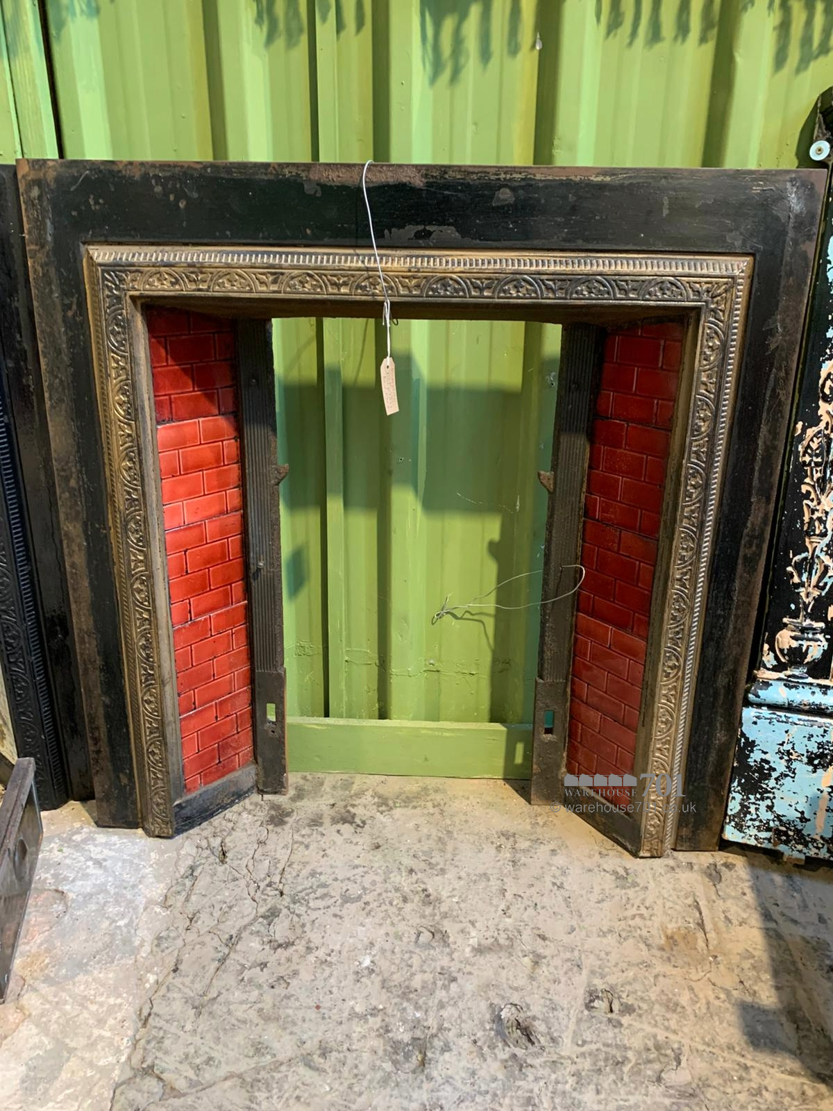 Cast iron fire place red tiles
