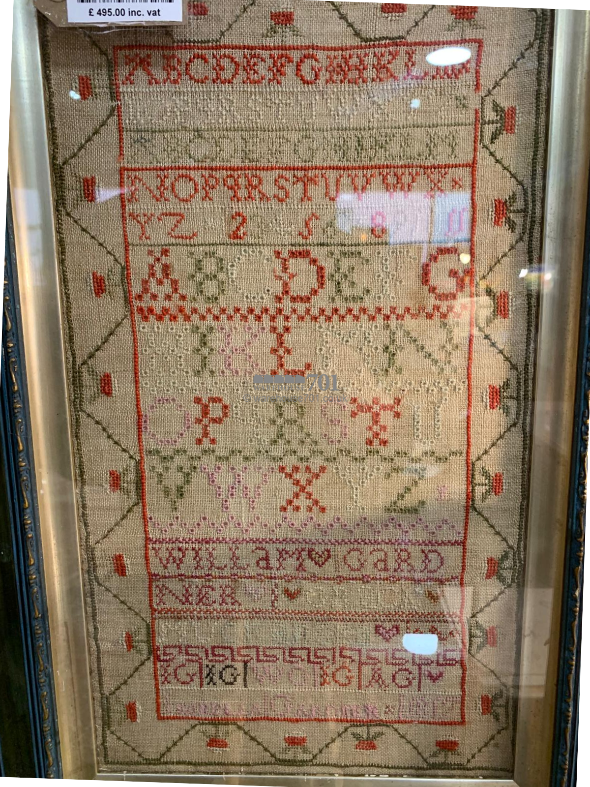 Alphabet sampler framed and glazed with a starwberry border - 1817