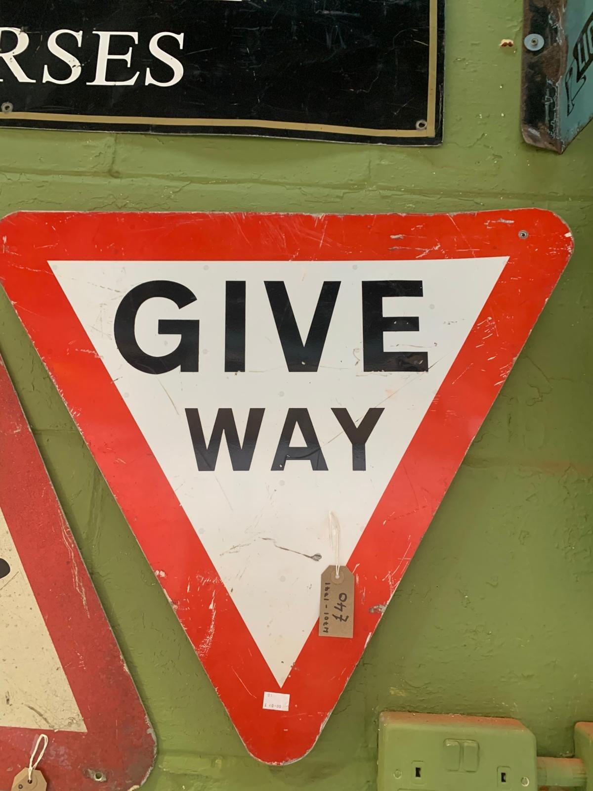 Metal triangular give way sign
