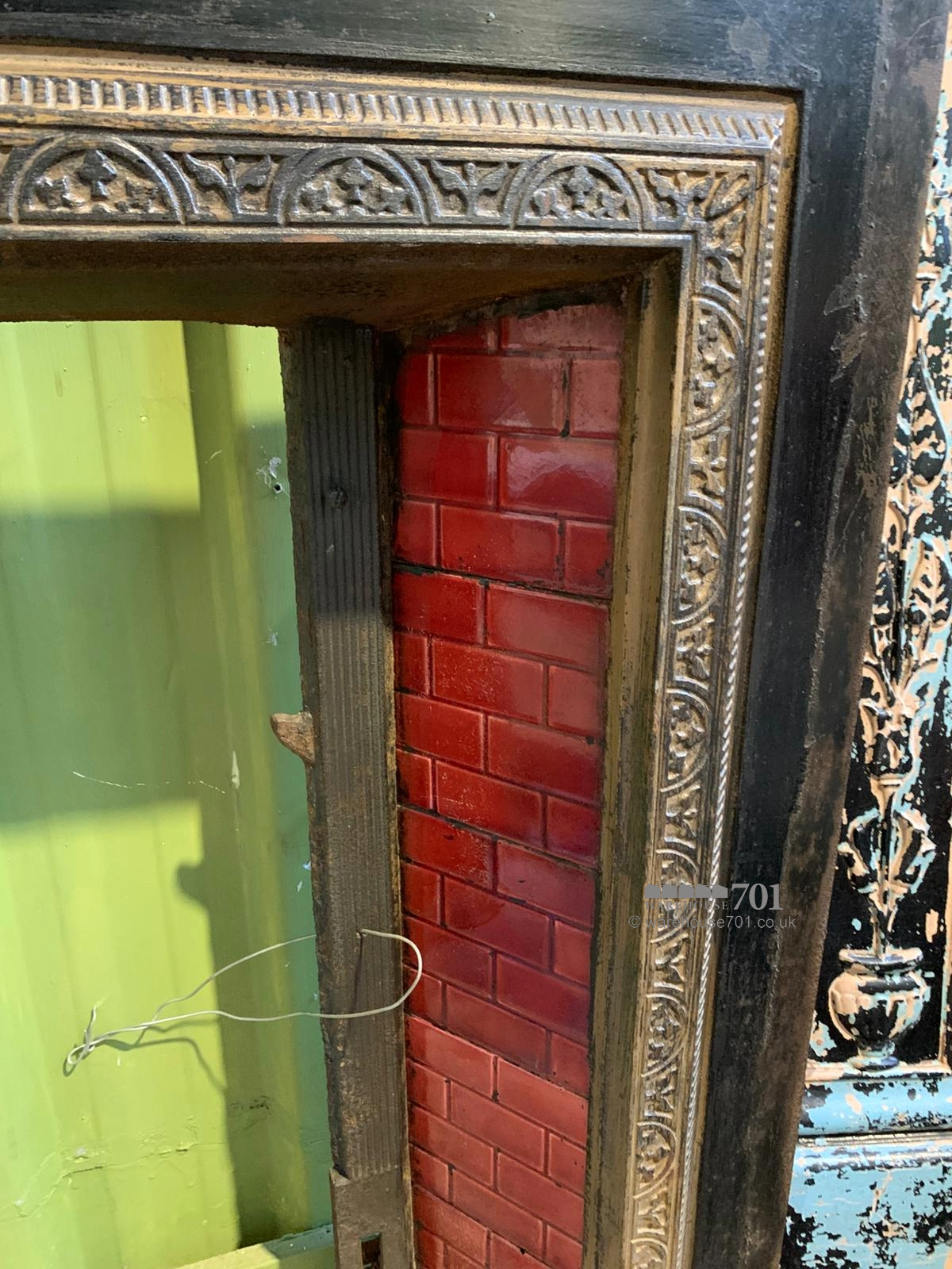 Cast iron fire place red tiles