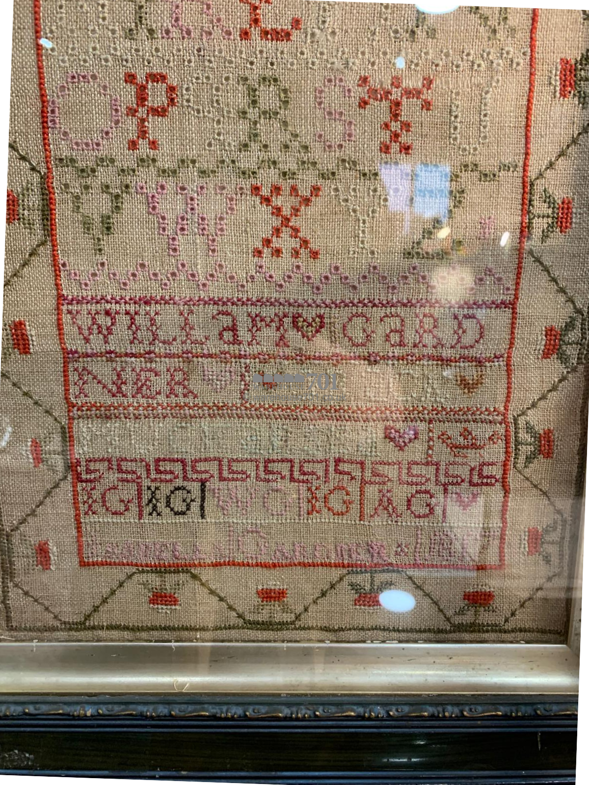 Alphabet sampler framed and glazed with a starwberry border - 1817