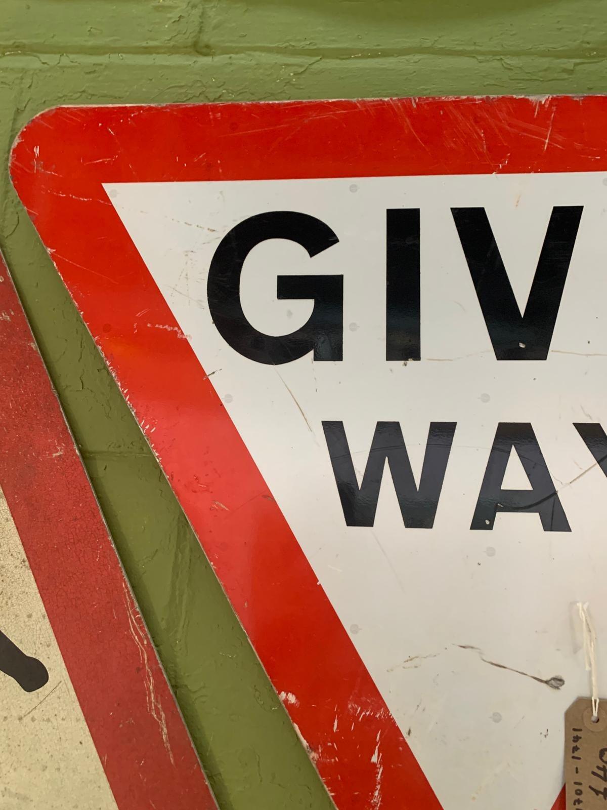 Metal triangular give way sign