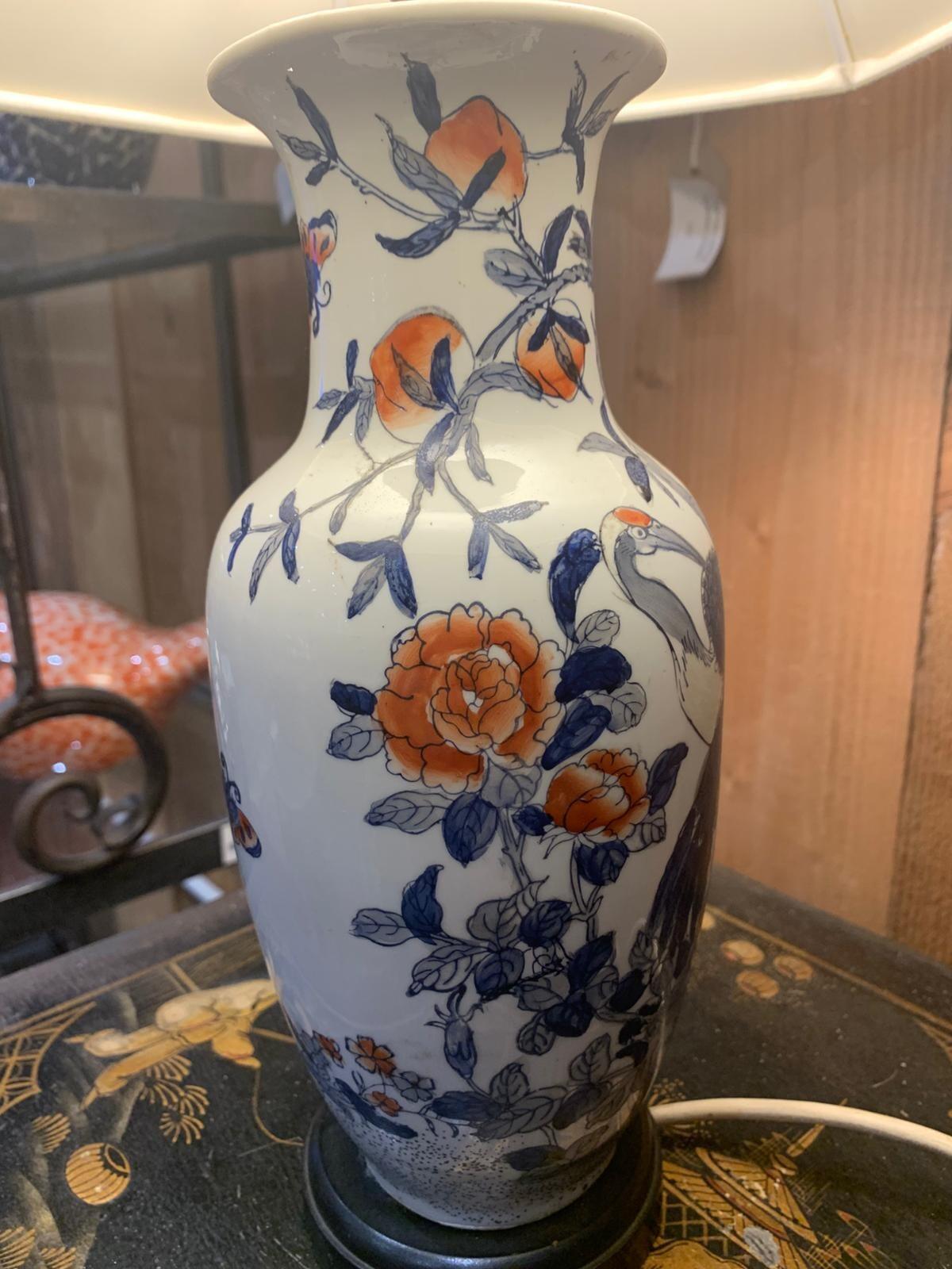 Blue and white lamp with crane
