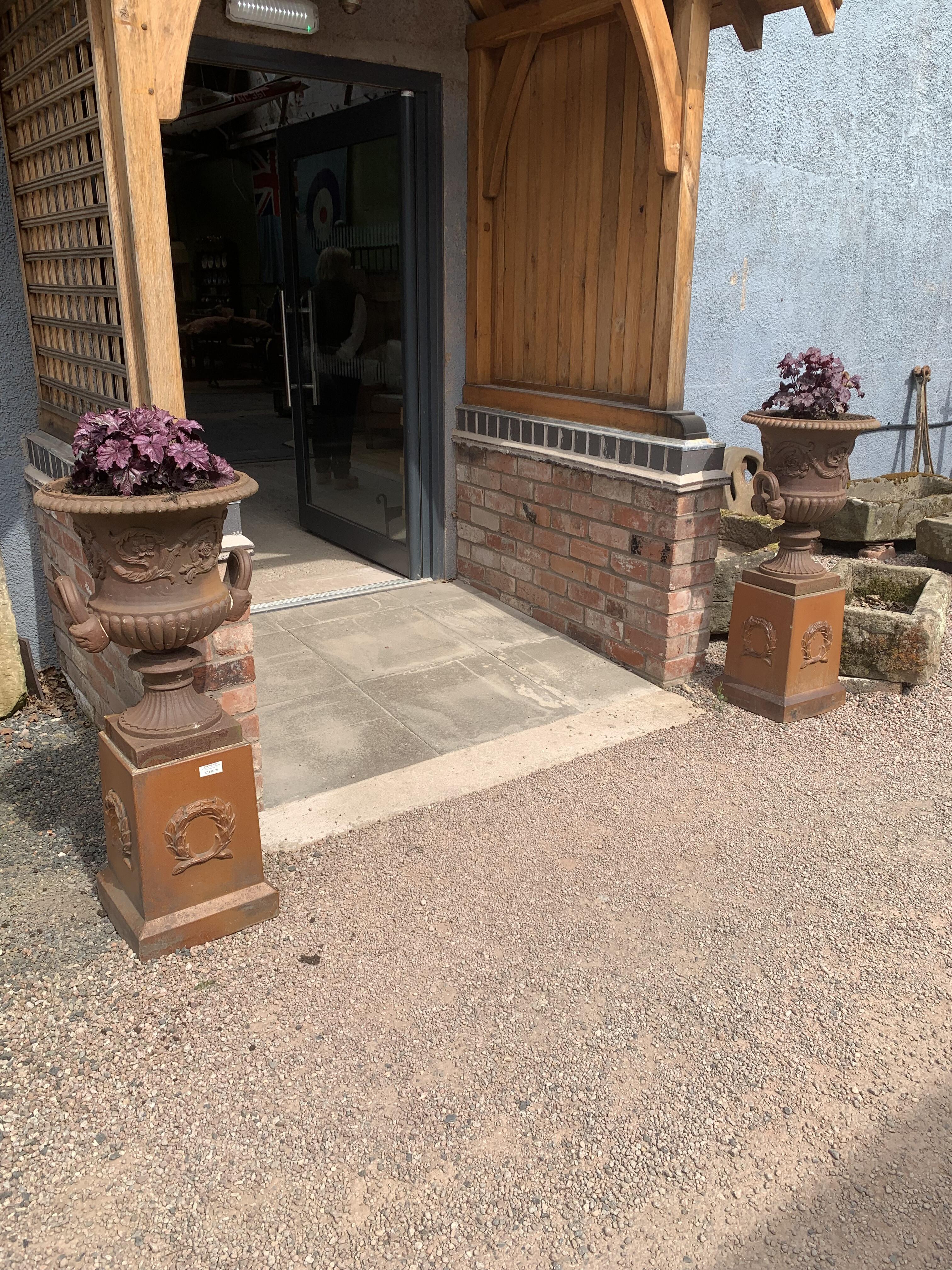 Antique Cast Iron Urns on Treacle Glazed Plinths