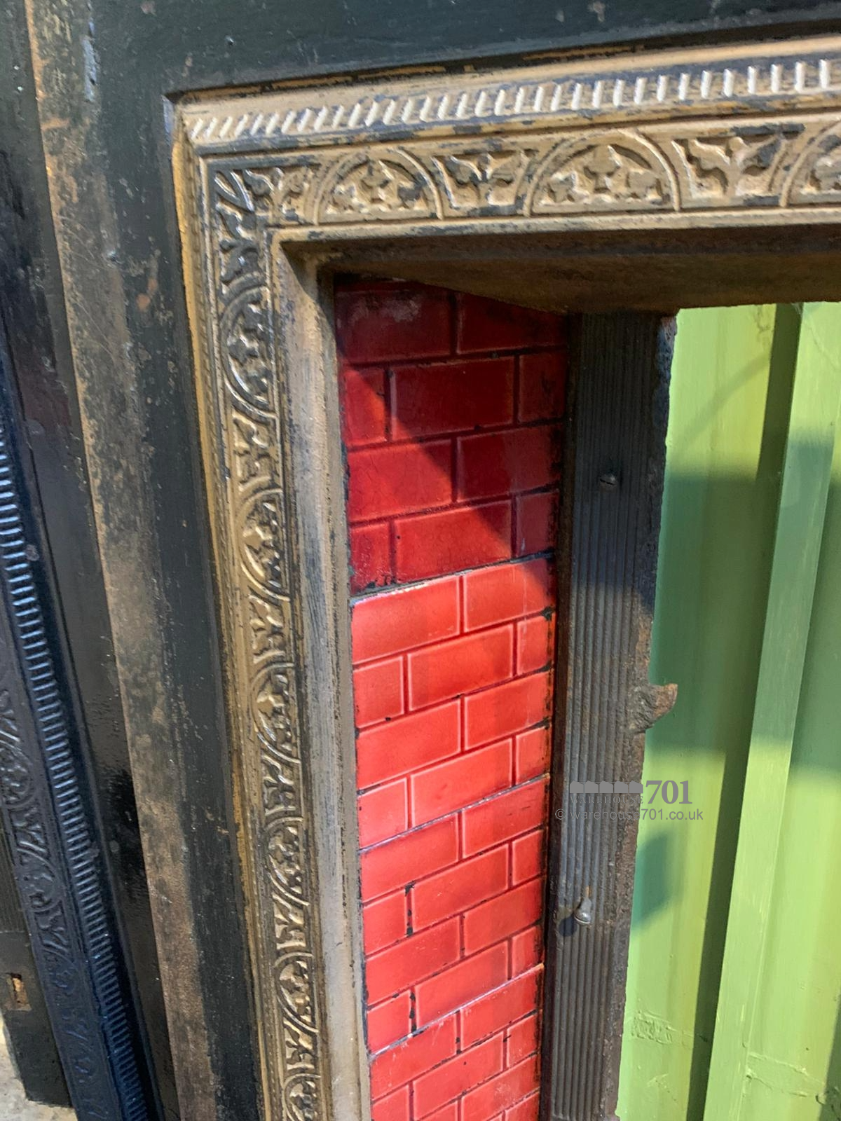 Cast iron fire place red tiles