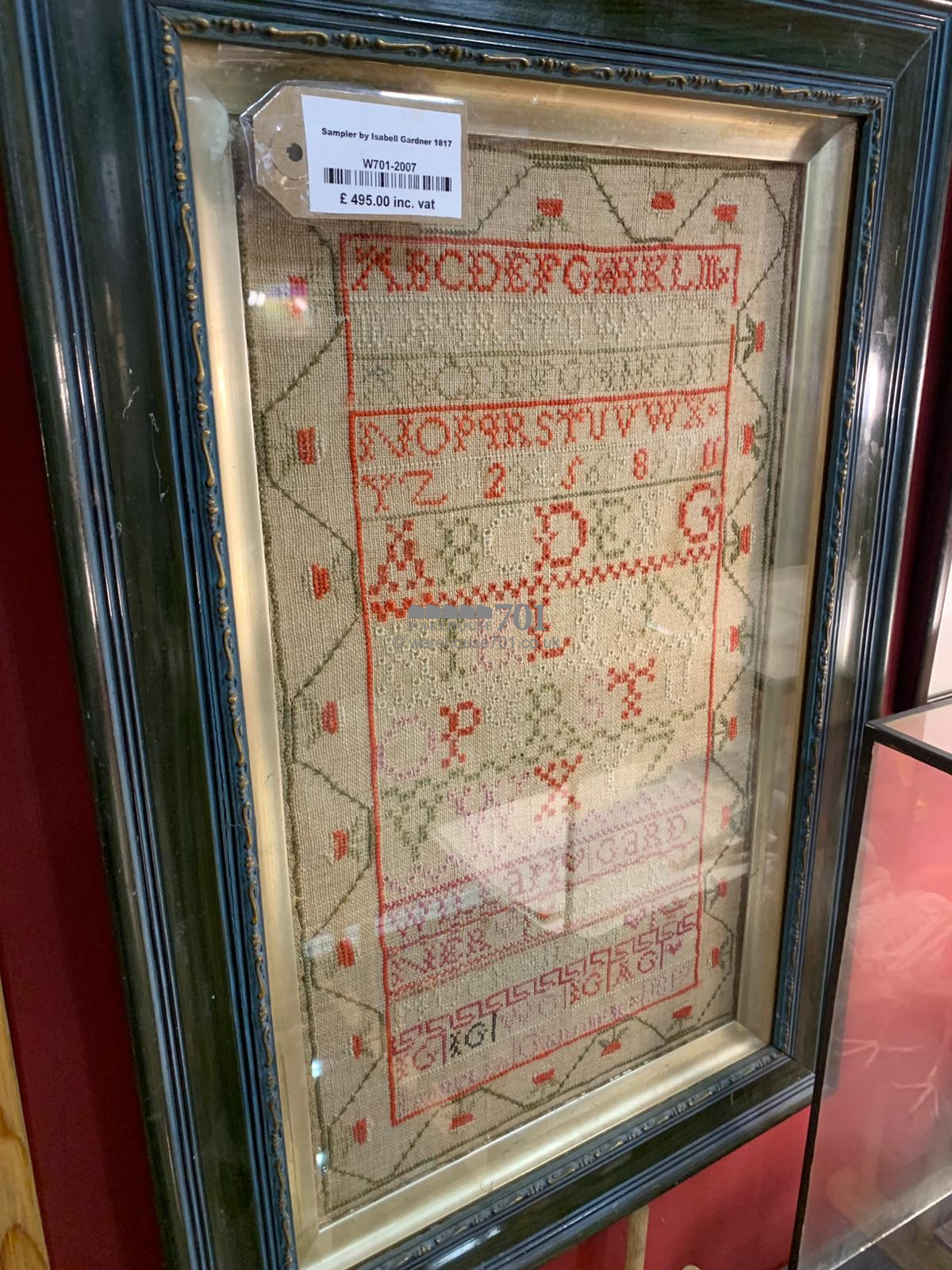 Alphabet sampler framed and glazed with a starwberry border - 1817