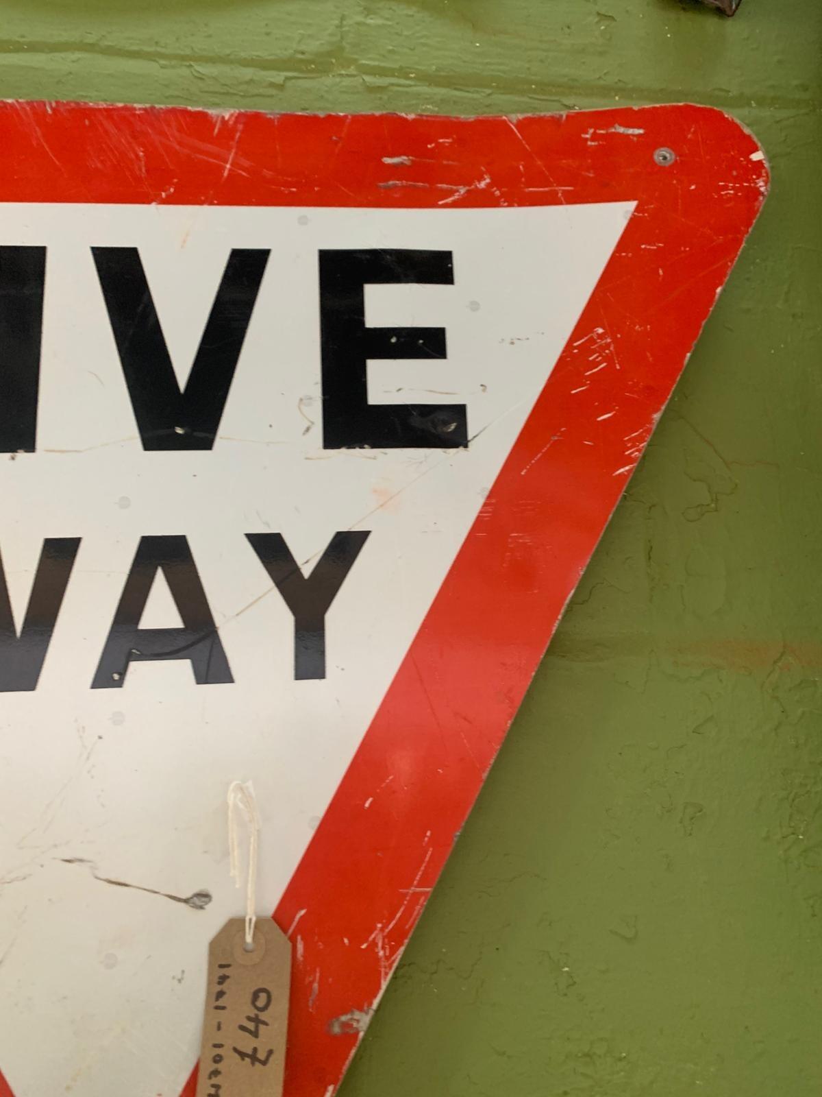Metal triangular give way sign