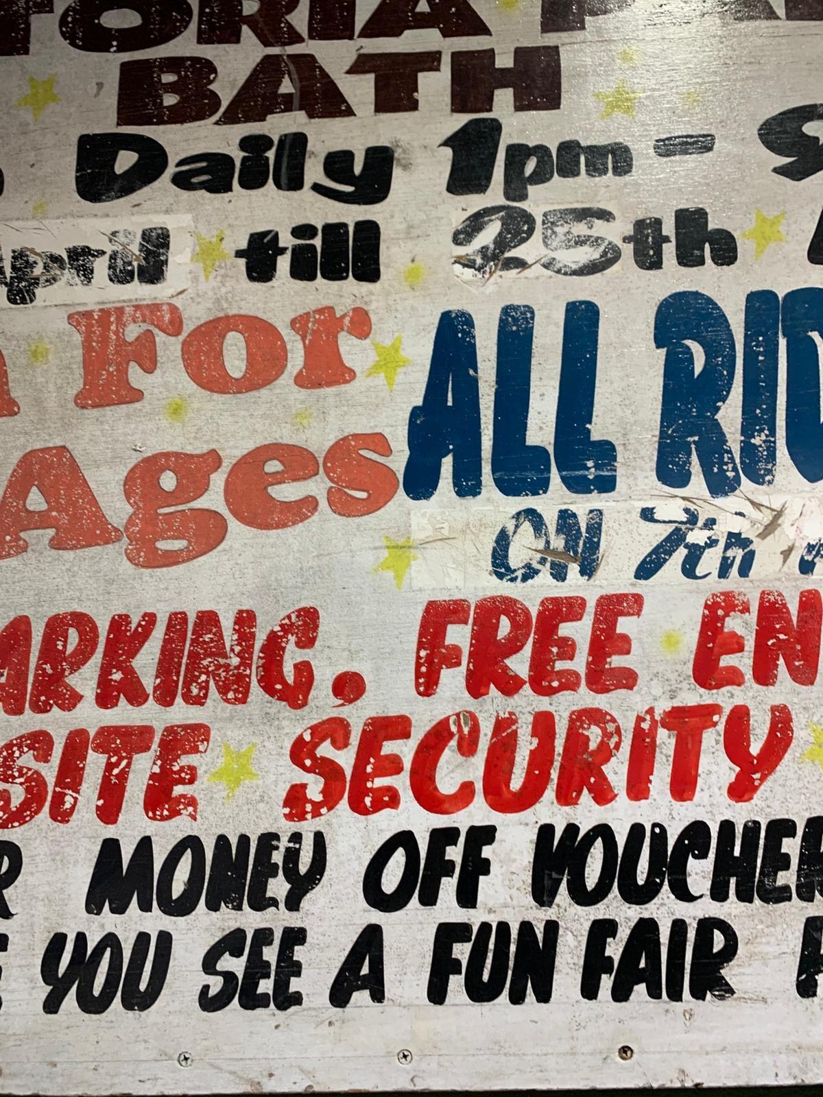 Metal family fun fair sign