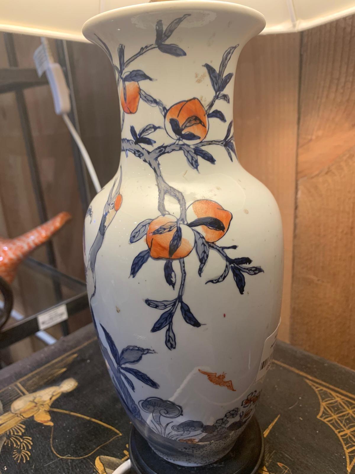 Blue and white lamp with crane