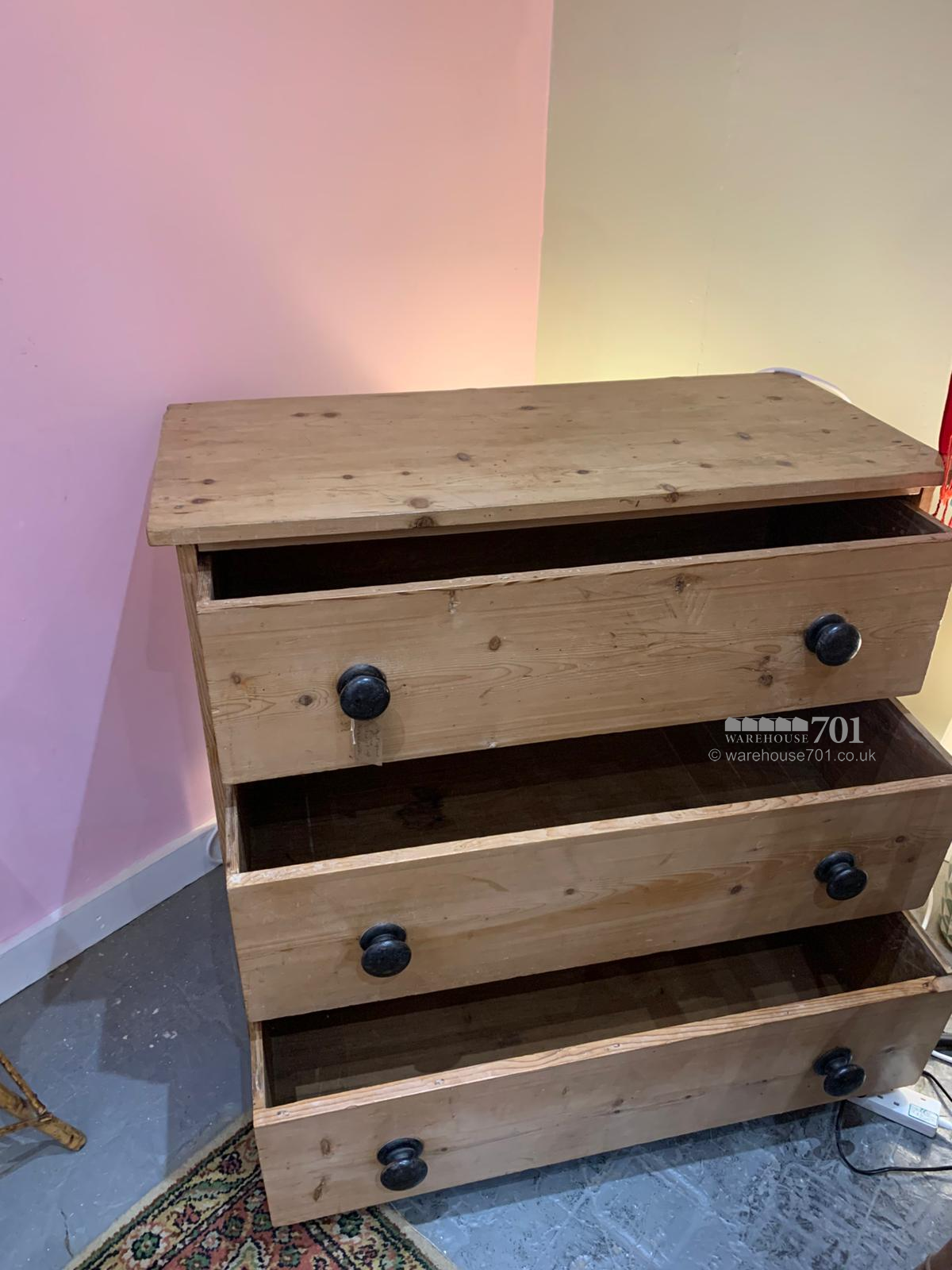 Antique pine chest of drawers with black handles