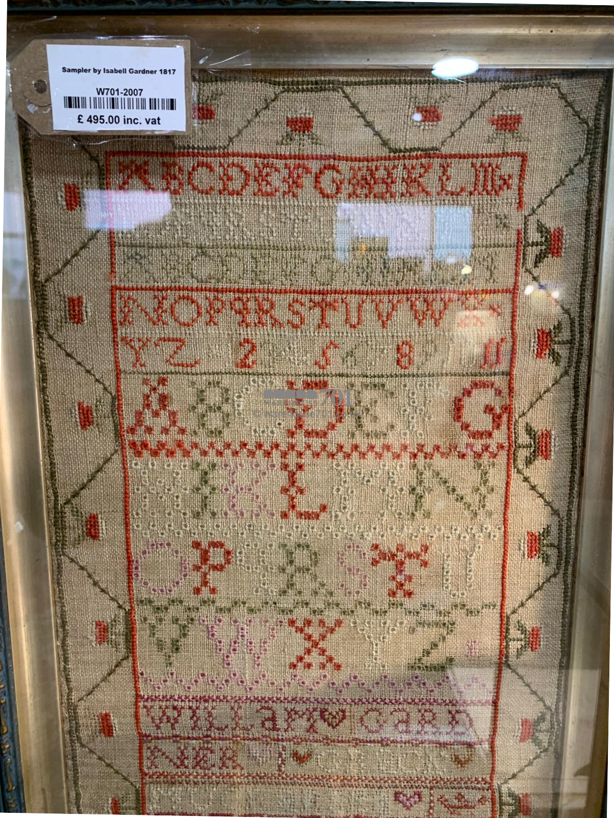 Alphabet sampler framed and glazed with a starwberry border - 1817