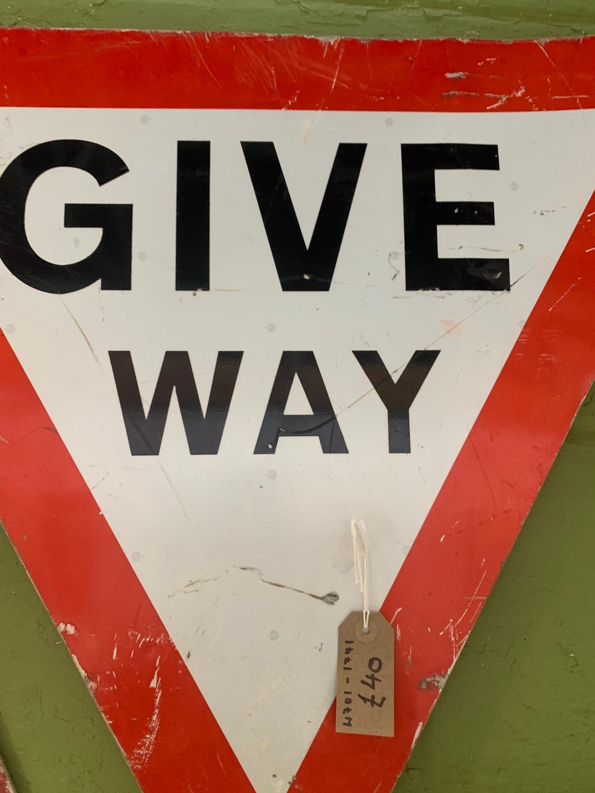 Metal triangular give way sign