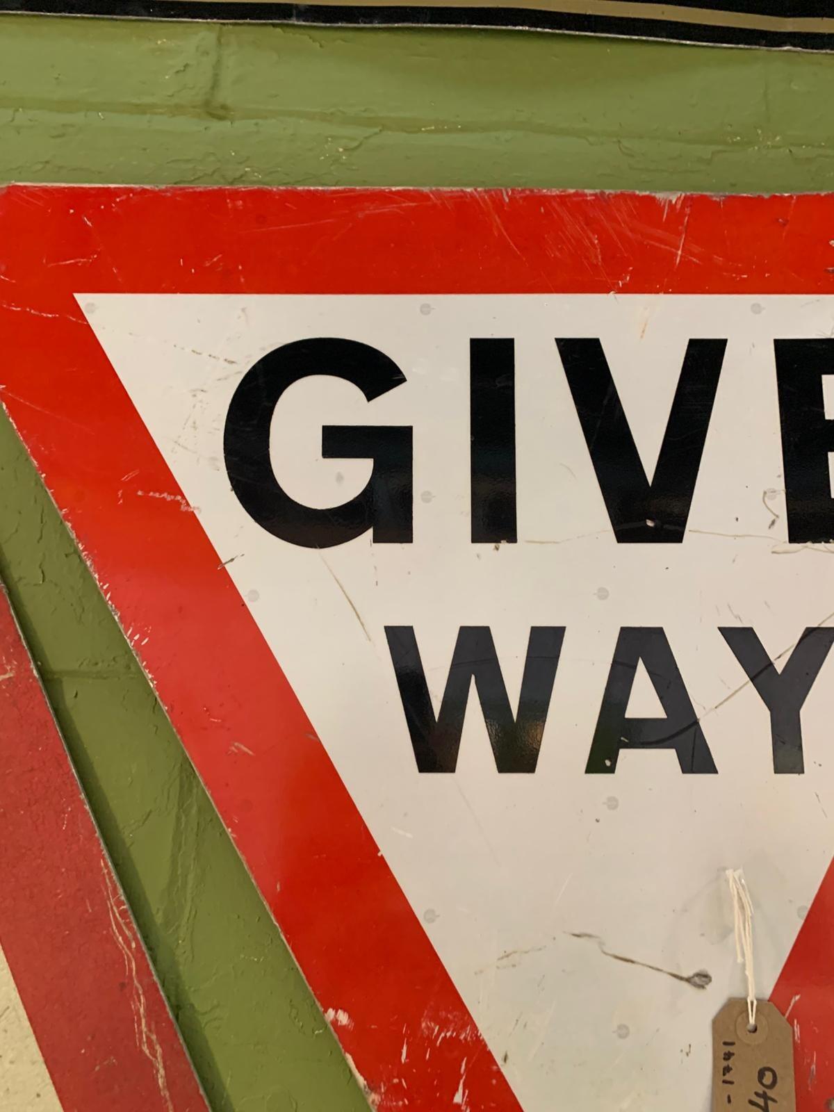 Metal children crossing triangle sign