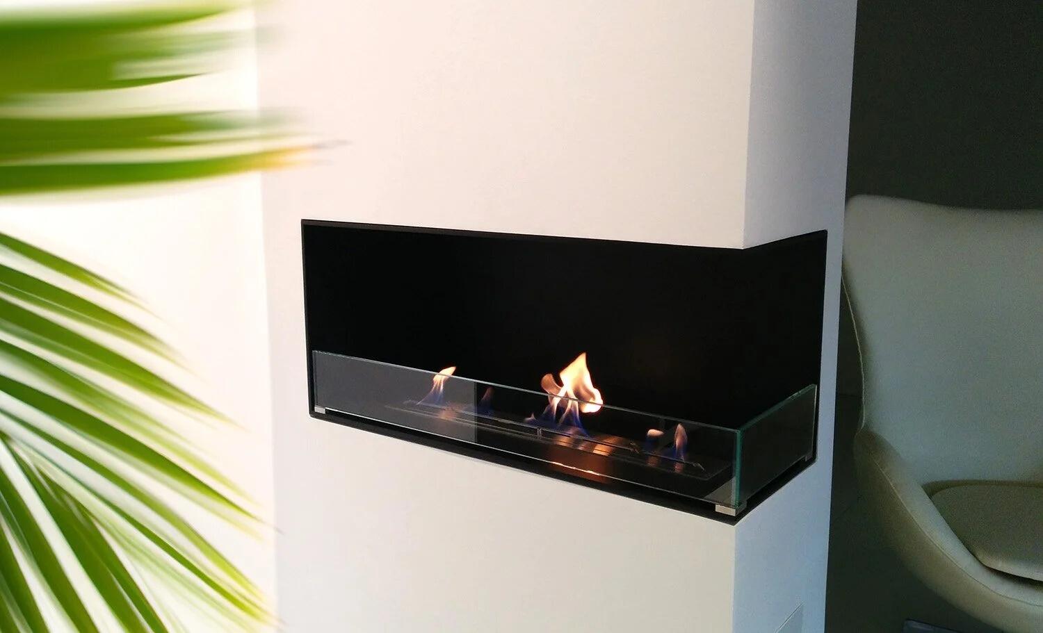 Montreal corner fire set into a white wall beside a palm leaf