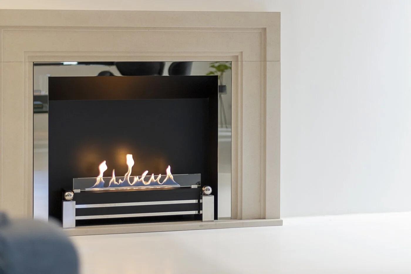Westminster fire with a pale stone frame and brushed steel insert
